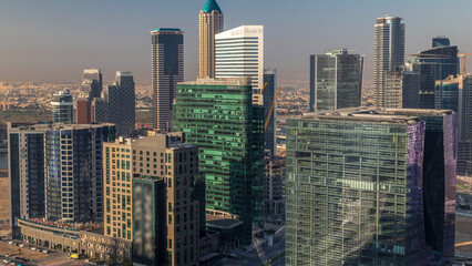 Obraz premium Dubai's business bay towers at morning aerial timelapse.