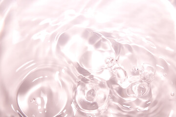 Soft Pink Water Ripple with Gentle Bubbles Under Bright Light