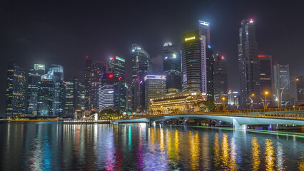 Esplanade bridge and downtown core skyscrapers in the background Singapore night timelapse hyperlapse