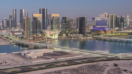 Naklejka premium Aerial skyline of Abu Dhabi city centre from above day to night timelapse