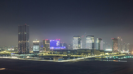 Buildings on Al Reem island in Abu Dhabi night timelapse from above.