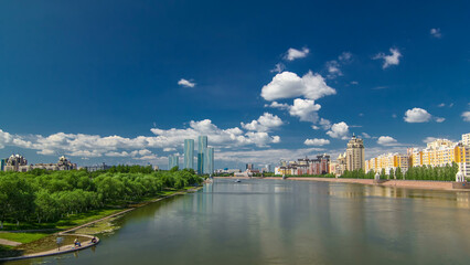 Yesil river timelapse hyperlapse with modern towers of residential complex in Astana