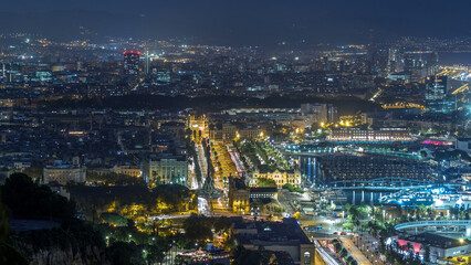 Obraz premium Aerial view over square Portal de la pau day to night timelapse in Barcelona, Catalonia, Spain.