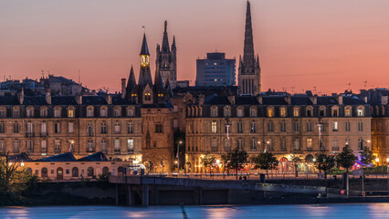 Fototapeta premium Panoramic view of Bordeaux city skyline day to night transition timelapse. France