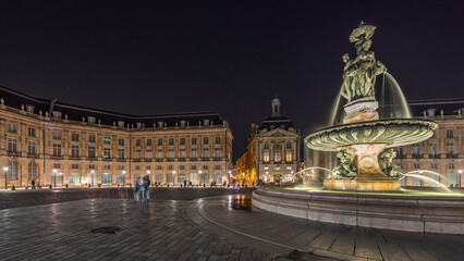 Fototapeta premium Place de la Bourse panorama and the fountains at night timelapse in Bordeaux, France.