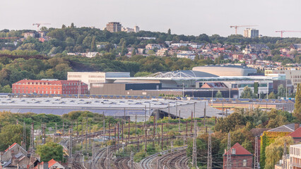 Aerial timelapse of Brussels North station railway tracks with trains arriving and departing. Belgium