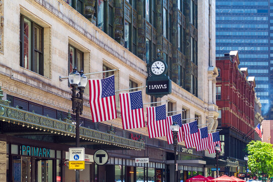American flags proudly adorn historic Burnham Building, home to Primark and Havas in downtown Boston, on May 27, 2025, Boston, Massachusetts, USA