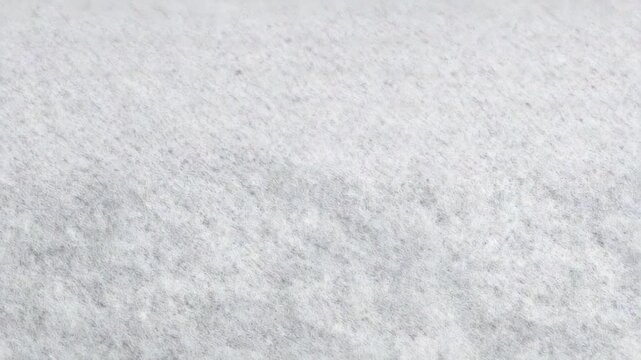 4k Closeup of white nonwoven fabric texture with fine fibers isolated on white background gray fibers texture video