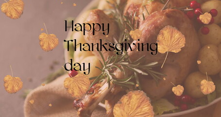 Fototapeta premium Image of happy thanksgiving day text over turkey dinner and autumn leaves background