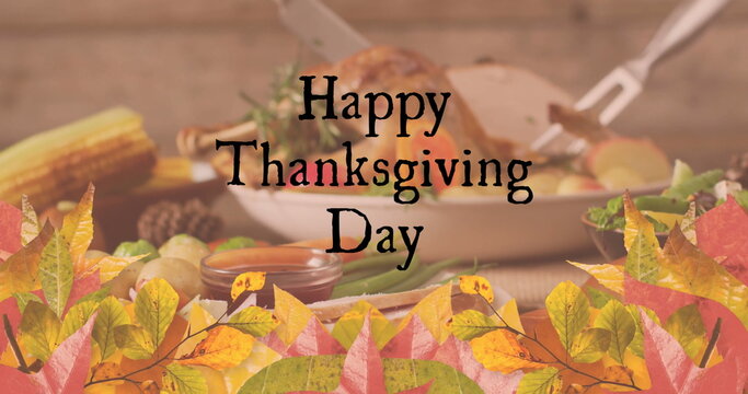 Fototapeta Image of happy thanksgiving day text over turkey dinner and autumn leaves background