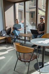 Two knowledgeable professionals collaborating effectively together in a modern workspace setting