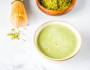 Matcha green tea beverage with bamboo whisk