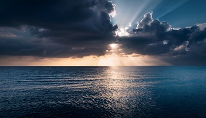 A Radiant Light Pierces Through Dark Clouds Reflecting On A Tranquil Ocean Surface Creating A Serene And Mystical Atmosphere