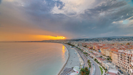 Fototapeta premium Sunset over Nice city and Mediterranean Sea aerial timelapse