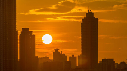 Sunset and silhouettes of buildings timelapse. Hong Kong