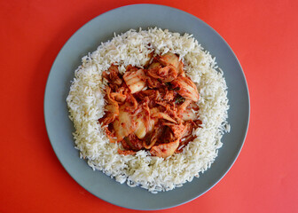 Kim Chi with long grain rice on a plate.