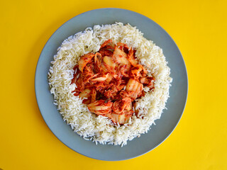 Kim Chi with long grain rice on a plate.