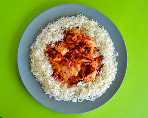 Kim Chi with long grain rice on a plate.