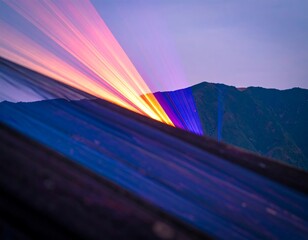 Vibrant sunset rays illuminating mountain landscape