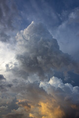 Dramatic storm clouds before a thunder-storm at sunset.