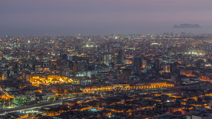 Aerial view of Lima skyline day to night timelapse from San Cristobal hill.