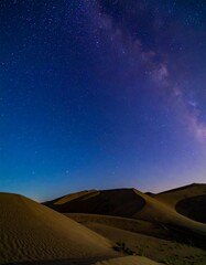 Night desert landscape with a starry sky