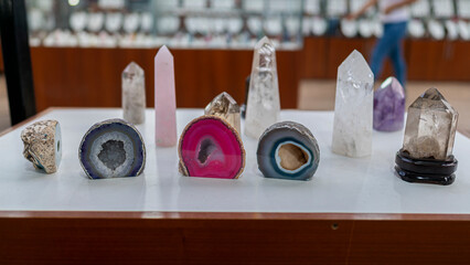 Display of quartz crystals and geodes in Peru. Natural gemstones polished and raw, used for decoration, jewelry, and energy healing practices.
