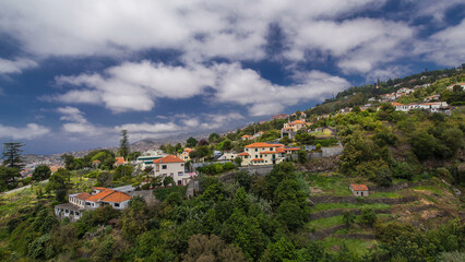 Obraz premium View from the mountain over the rooftops from cable car on Madeira timelapse hyperlapse.