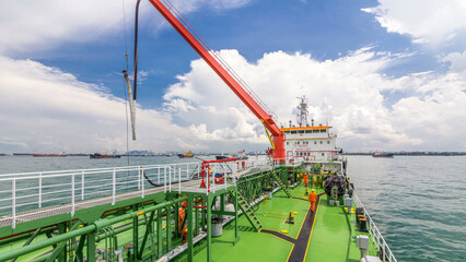Green deck of the tanker under blue sky timelapse