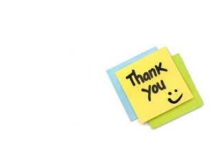 Thank you message on colorful note paper isolated on white background with smile emoji, Copy space