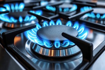 Close-up of a gas stove burner with blue flames burning evenly, showcasing clean and modern kitchen appliance with metallic and black components