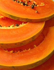 Close-up of stacked papaya slices