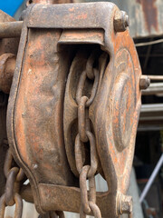 detail of a rusty machine, reel and chain