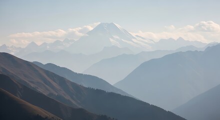 Majestic Mountain Range in Misty Valley.
