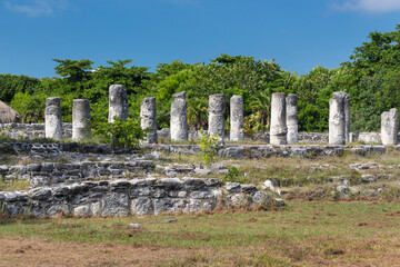 Beautiful shot of an ancient ruins over a stone bases of mayan city into el rey archaeological site