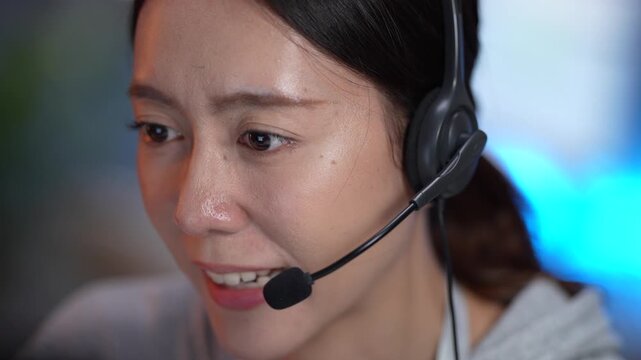 A customer support specialist uses a VoIP headset to handle an inbound service ticket. She updates the CRM while providing remote assistance to ensure customer satisfaction.