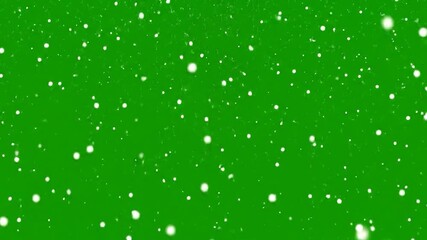 Snowfall effect with bright white snowflakes falling against a green screen backdrop - Powered by Adobe