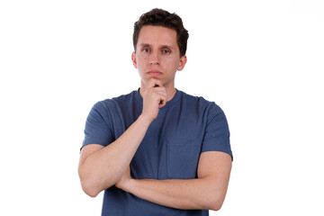 Thoughtful man analyzing with blue shirt on white background