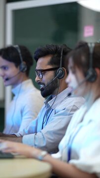 A team of Customer Service Representatives (CSRs) actively handles a high volume of inbound calls in a contact center, working to meet their Service-Level Agreement (SLA) targets.