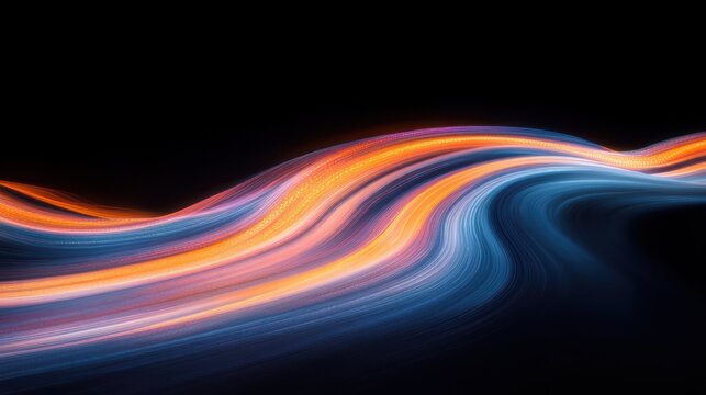 Abstract flowing light trails in dynamic waves of blue and orange on a black background creating a sense of motion and energy