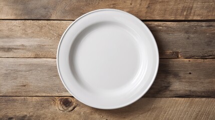 White ceramic plate with smooth rim on aged wooden planks