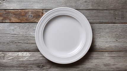 White ceramic plate with smooth rim on aged wooden planks