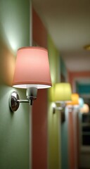 Wall sconces in a brightly colored hallway