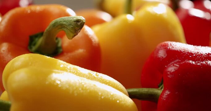 A vibrant close-up image of fresh, colorful bell peppers in red, yellow, and orange, showcasing their natural beauty and freshness. Fresh Colorful Bell Peppers Close-Up