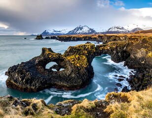 Dramatic coastal archway with dramatic waves