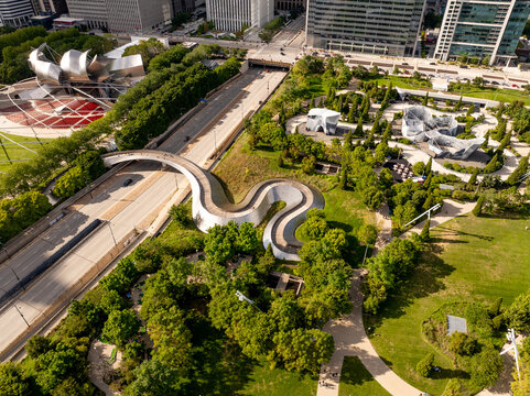 Aerial View of Millennium Park with BP Pedestrian Bridge and Jay Pritzker Pavilion in Downtown Chicago Stunning aerial capture of Millennium Park in Chicago showcasing its modern architecture, 