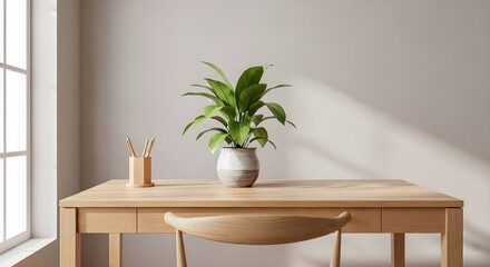 A light wood desk with a potted green plant and a wooden pencil holder near a window