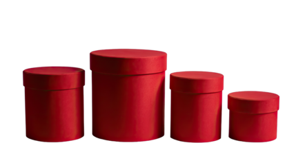 Four red cylindrical gift boxes of varying sizes