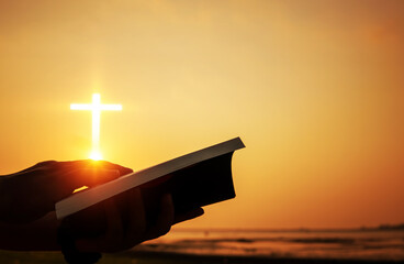Christian praise on hill thanksgiving day background. Christian man or woman hands holding and reading a bible holy. Hands folded in prayer. worship god with christian concept religion.