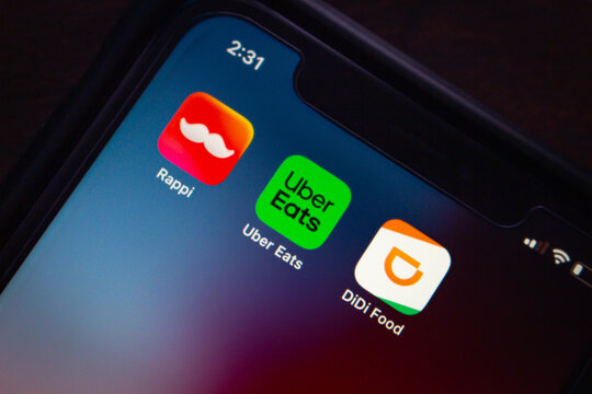 Mexico City, MEXICO - Aug 21 2025 : Close-up of Rappi, Uber Eats, and DiDi Food apps on a smartphone screen, representing food delivery services in Latin America.